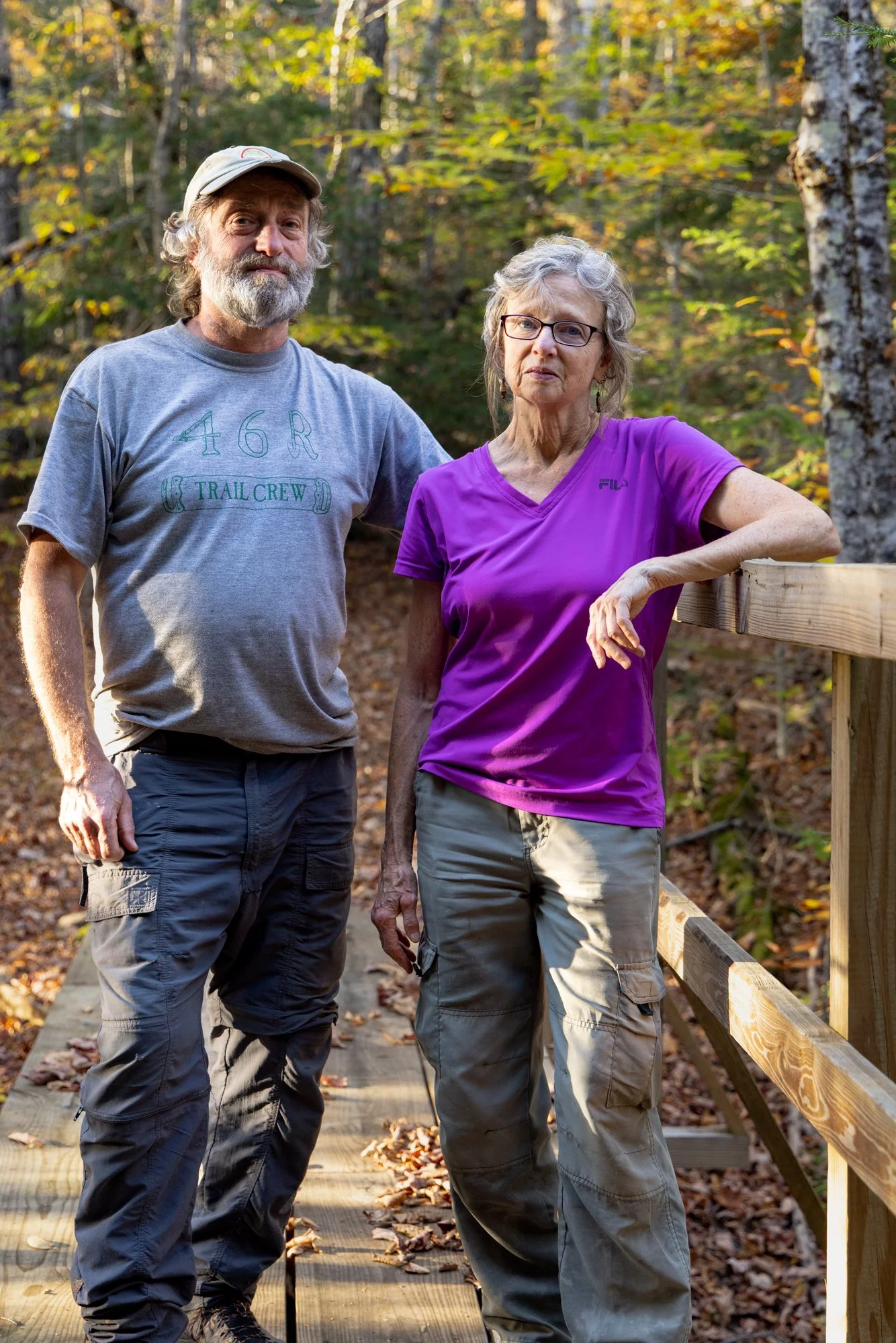 Mark and Kathy Simpson, 46ers and trail masters on a bride they built in the Adirondacks, NY