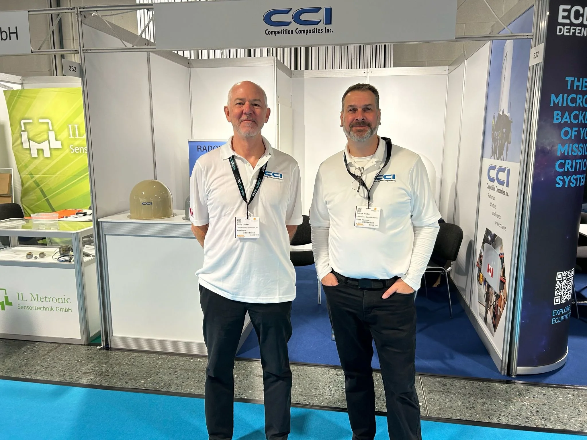 CCI staff in front of their radome booth at trade show
