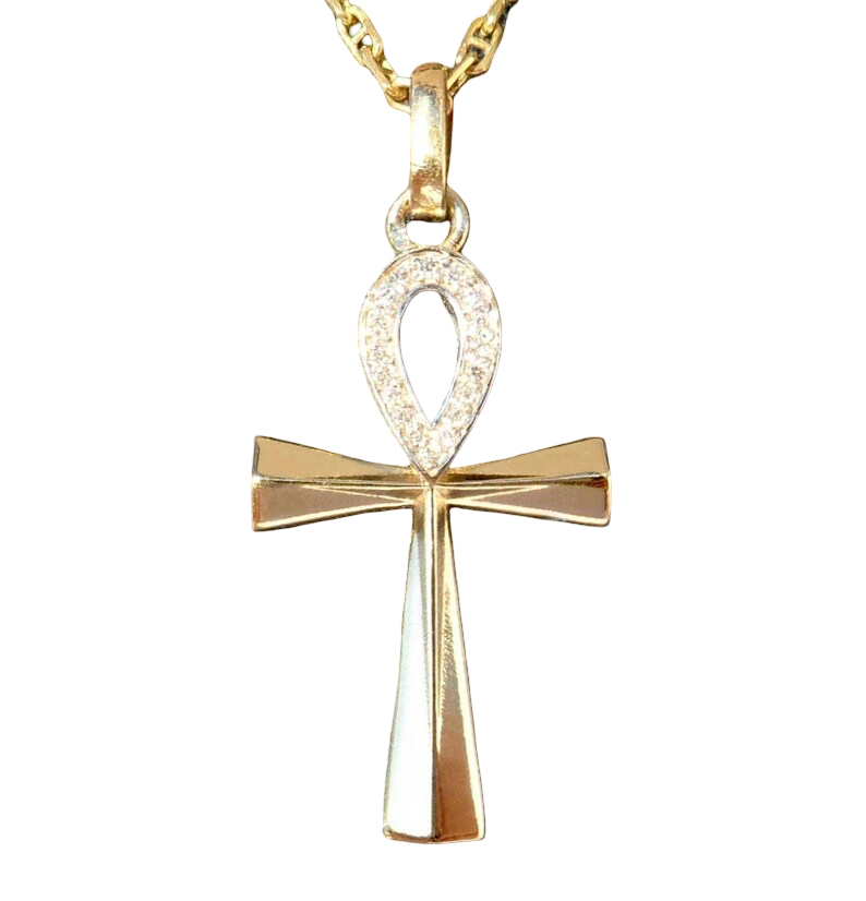 Ce pendentif porte-bonheur « Ankh » en or 18 carats et orné de diamants.