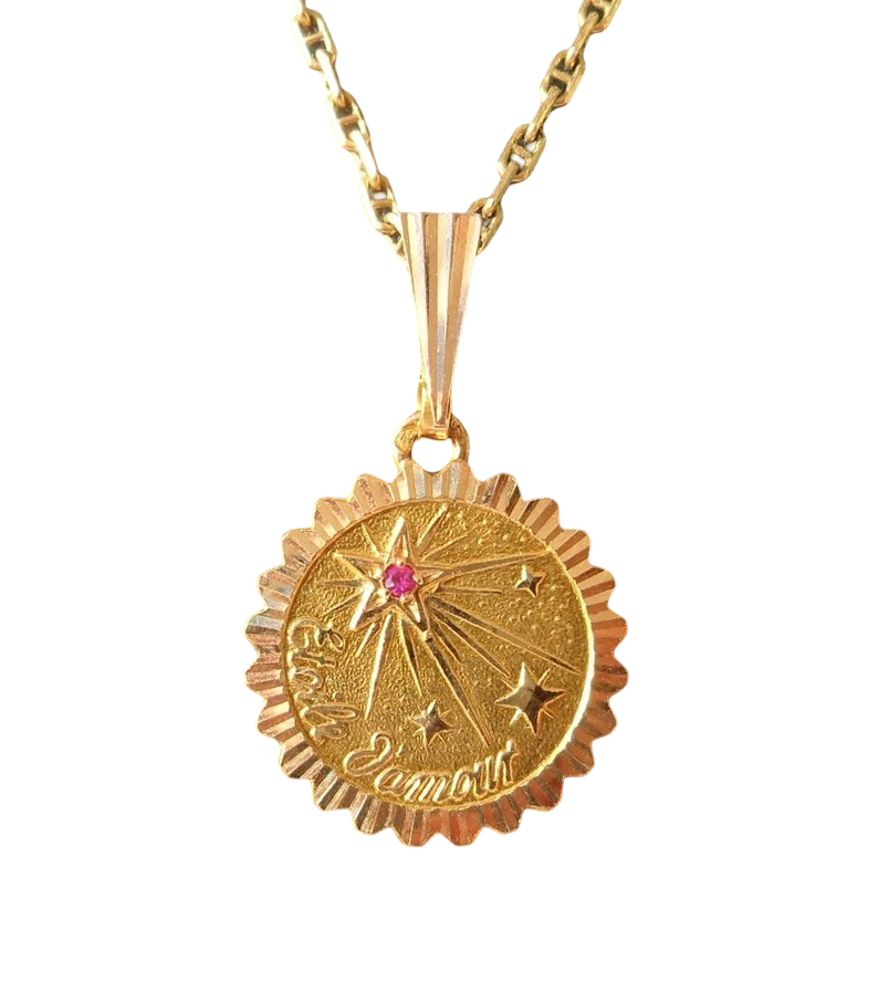 Pendentif « Etoile d'amour » signé Etoile d'amour, or 18 carats.