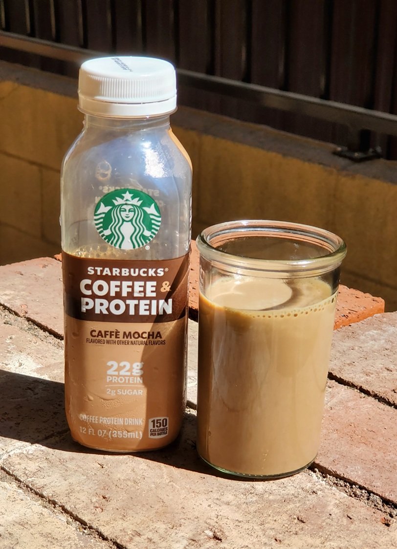 Bottle and a cup of Starbucks Coffee Protein Caffe Mocha