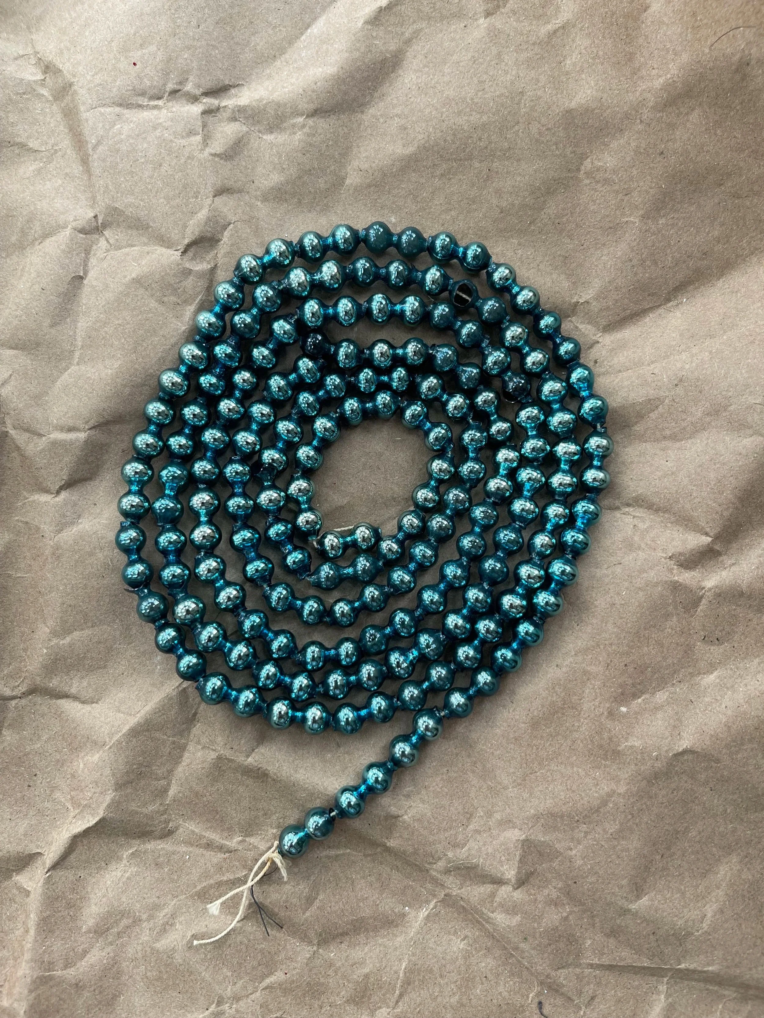 Blue mercury-glass beaded garland.
