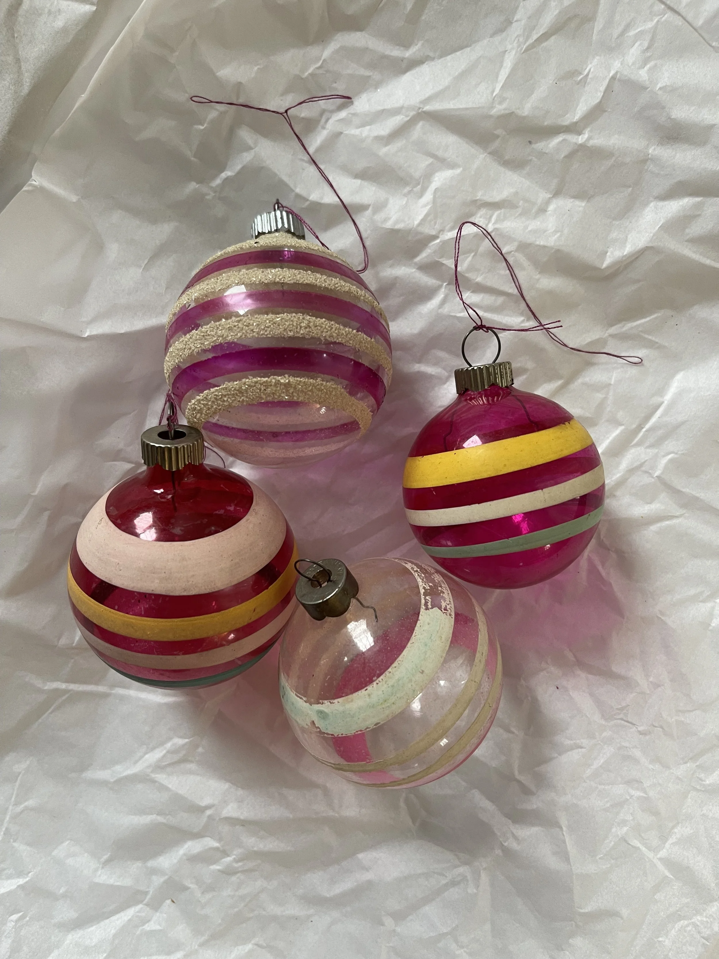 Unsilvered Ornaments |
Delicate and luminous, these WWII-era beauties glow softly thanks to their translucent, unsilvered glass. A rare glimpse of wartime history, right on your tree.