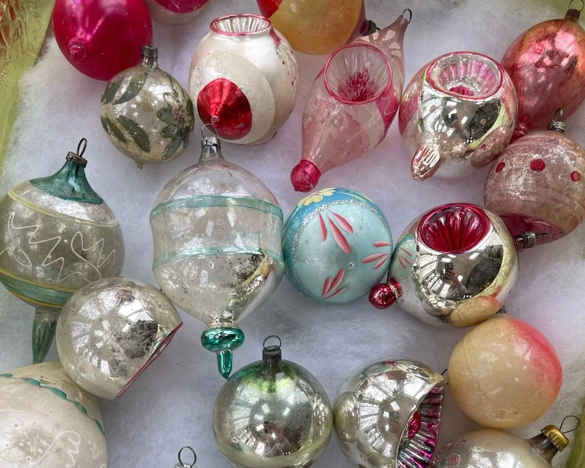 Vintage glass ornaments showing varied metal caps, wire loops, and neck areas