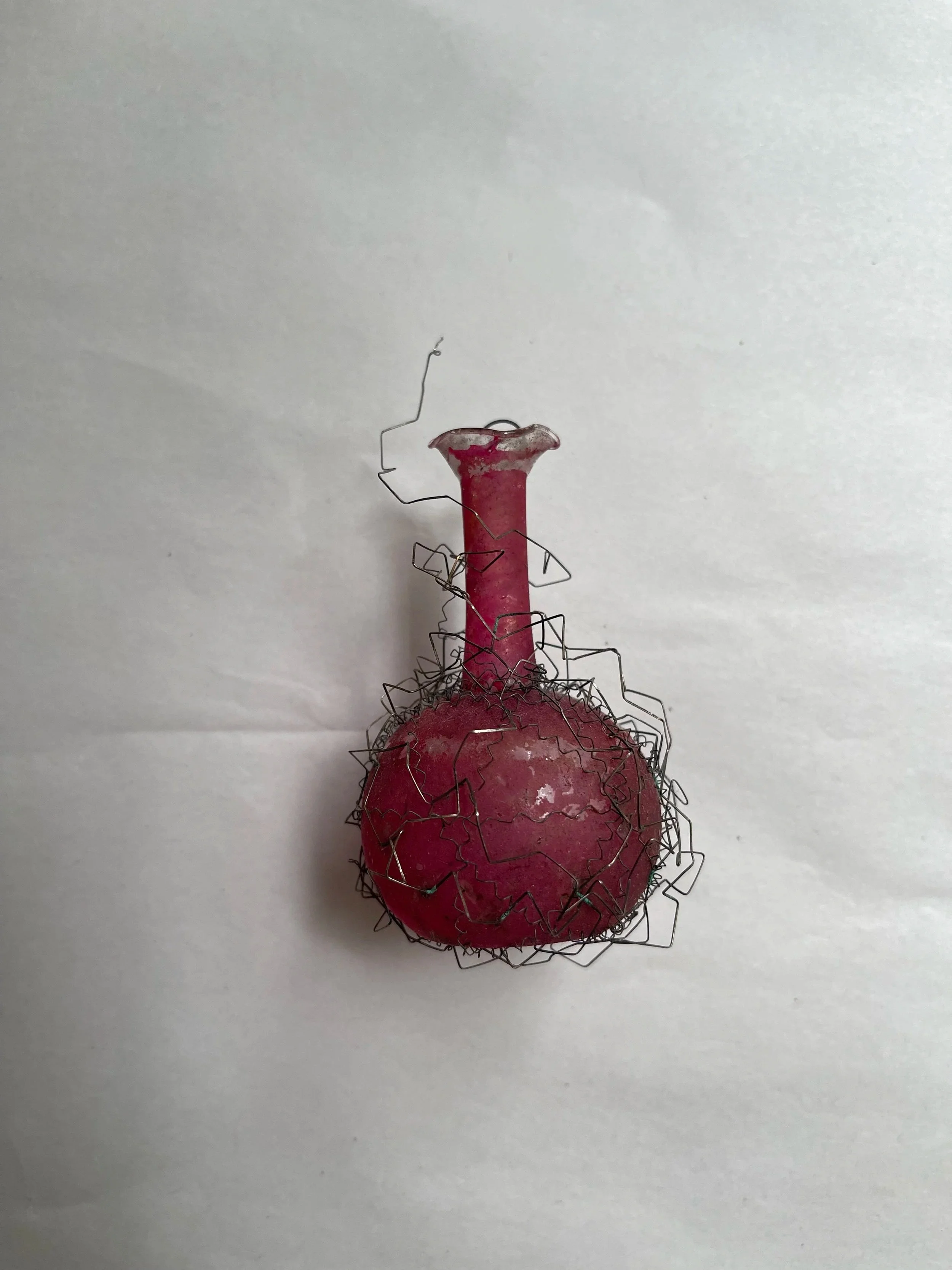 Antique German pink glass vase Christmas ornament wrapped in fine wire.
