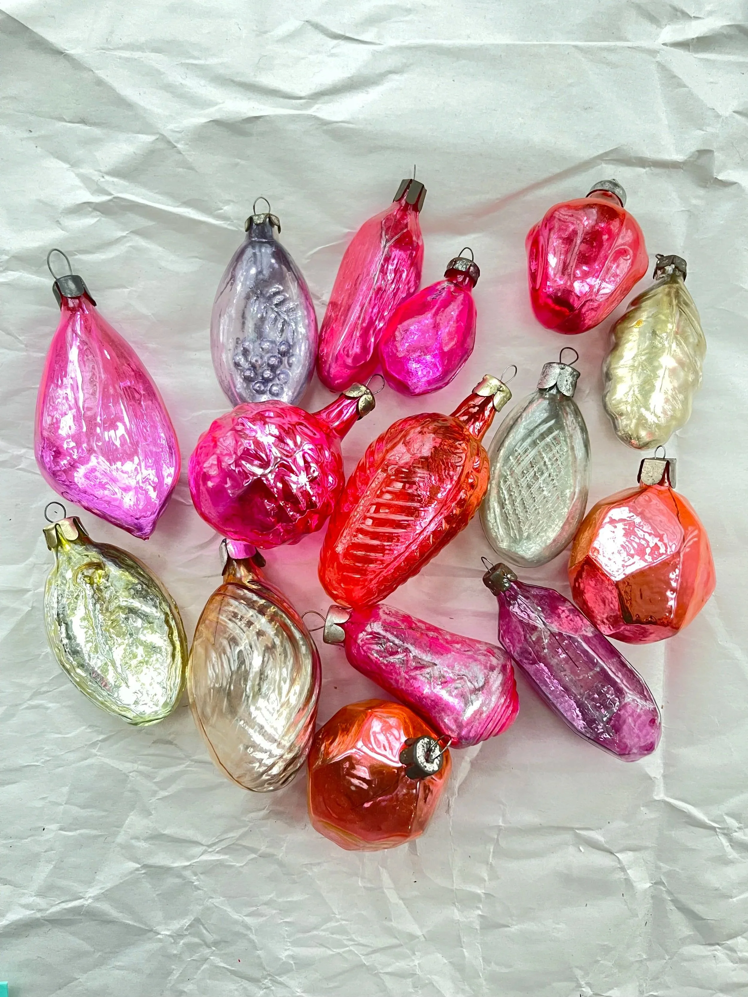 Lot of 15 mixed-shape glass ornaments with metallic backs.