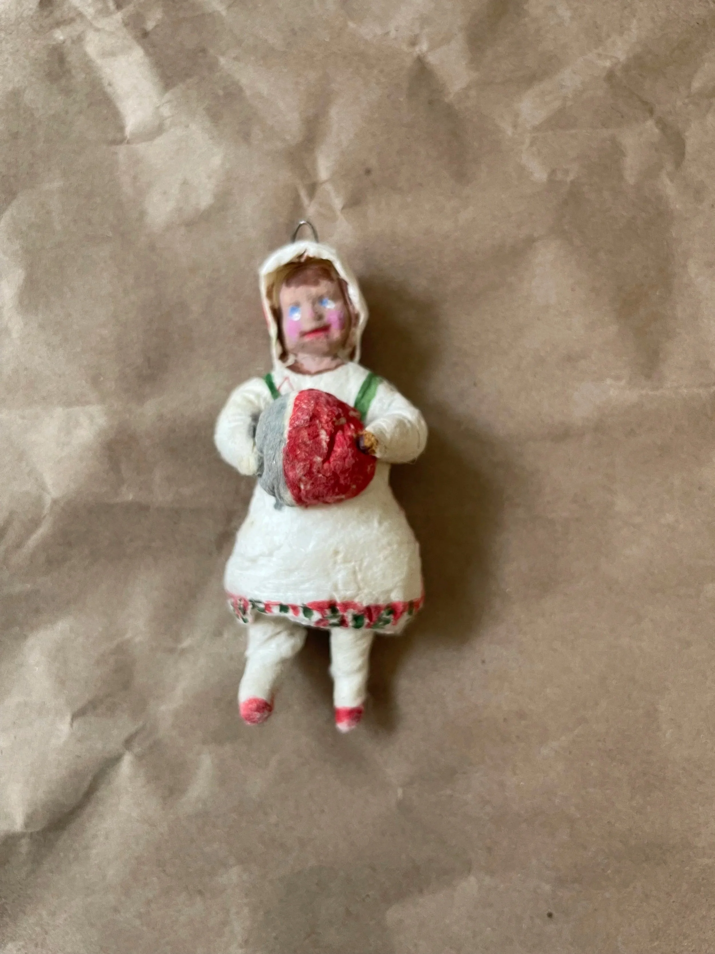 Russian spun-cotton child with a muff ornament.