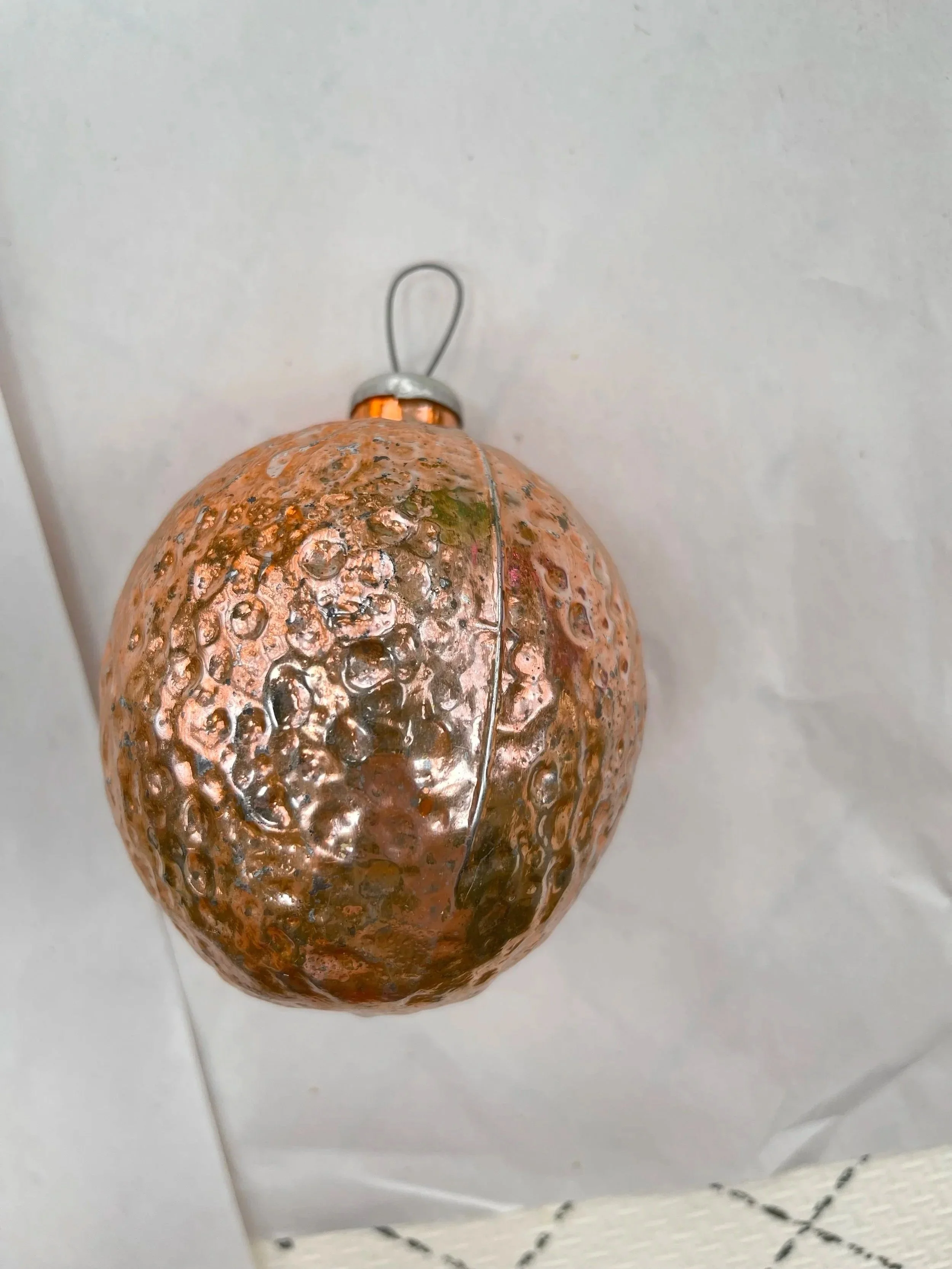Orange Kremlin-shaped glass Christmas ornament.