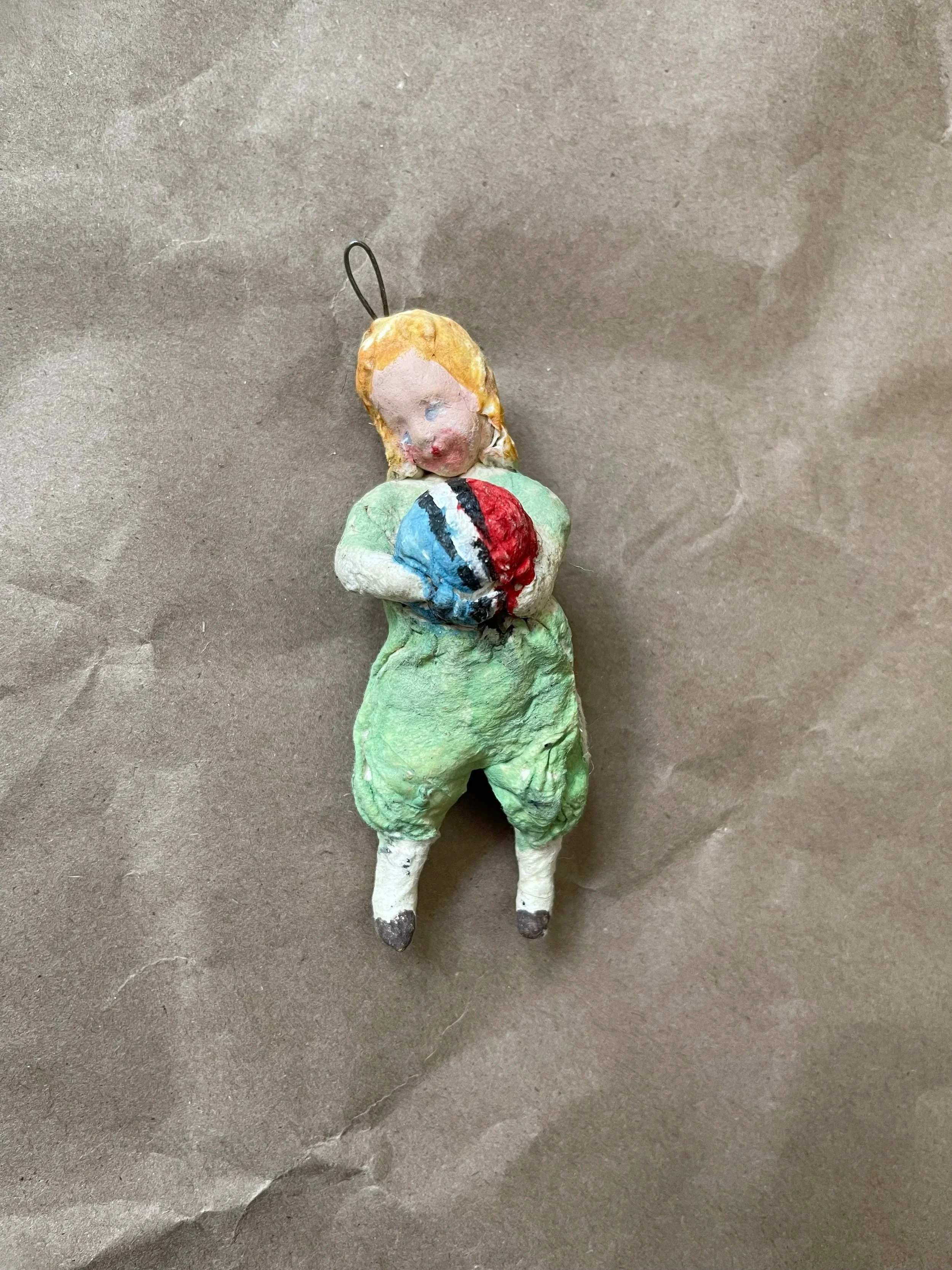 Russian Spun Cotton Child Ornament Holding Ball.