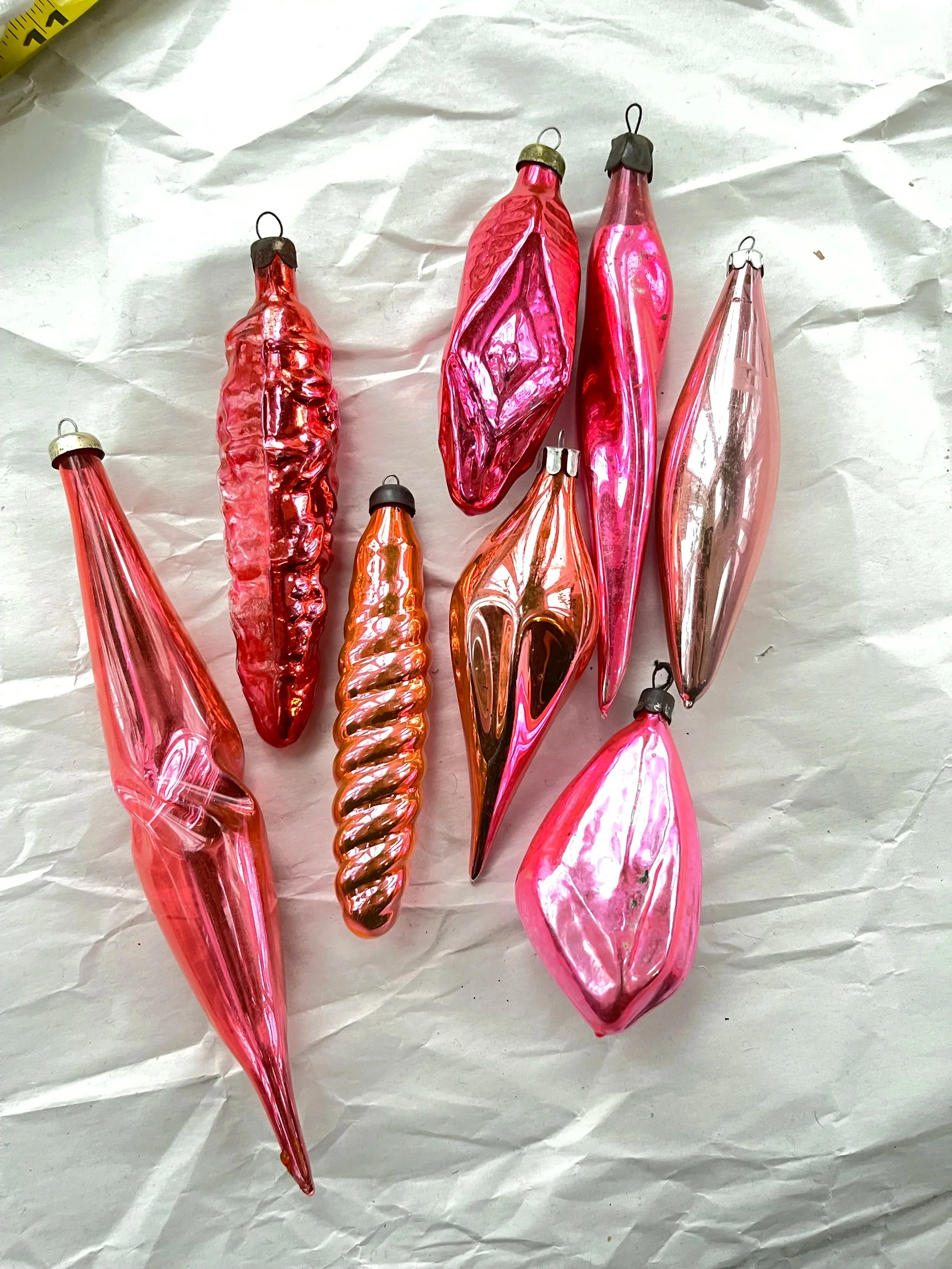 Set of eight midcentury glass icicle ornaments.