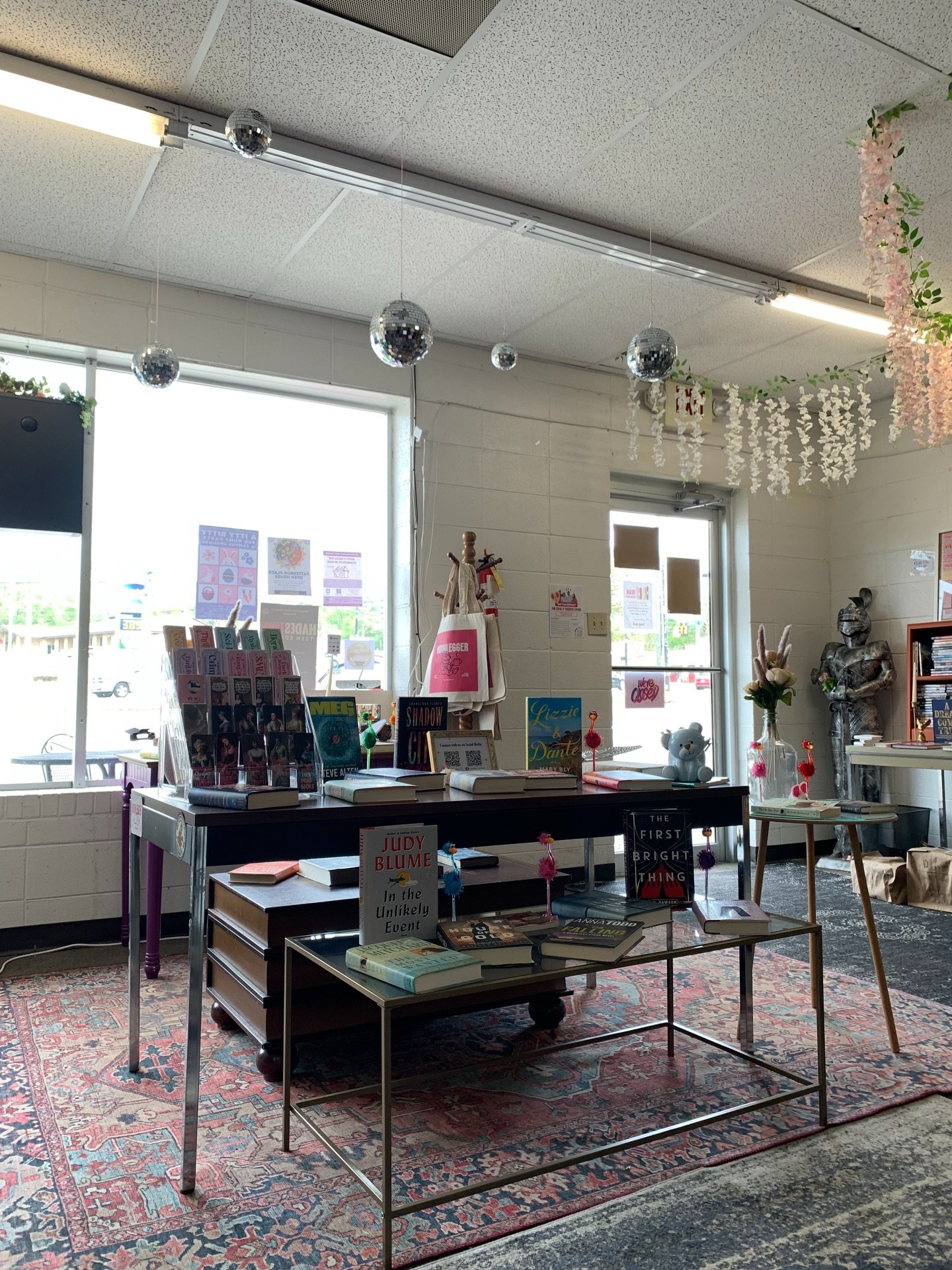 It&rsquo;s not just books&hellip; it&rsquo;s disco balls, flamingo pens, dino pens, claw clips, and Booklegger goodies too 🦩🦖✨ Come see what&rsquo;s new on the table!