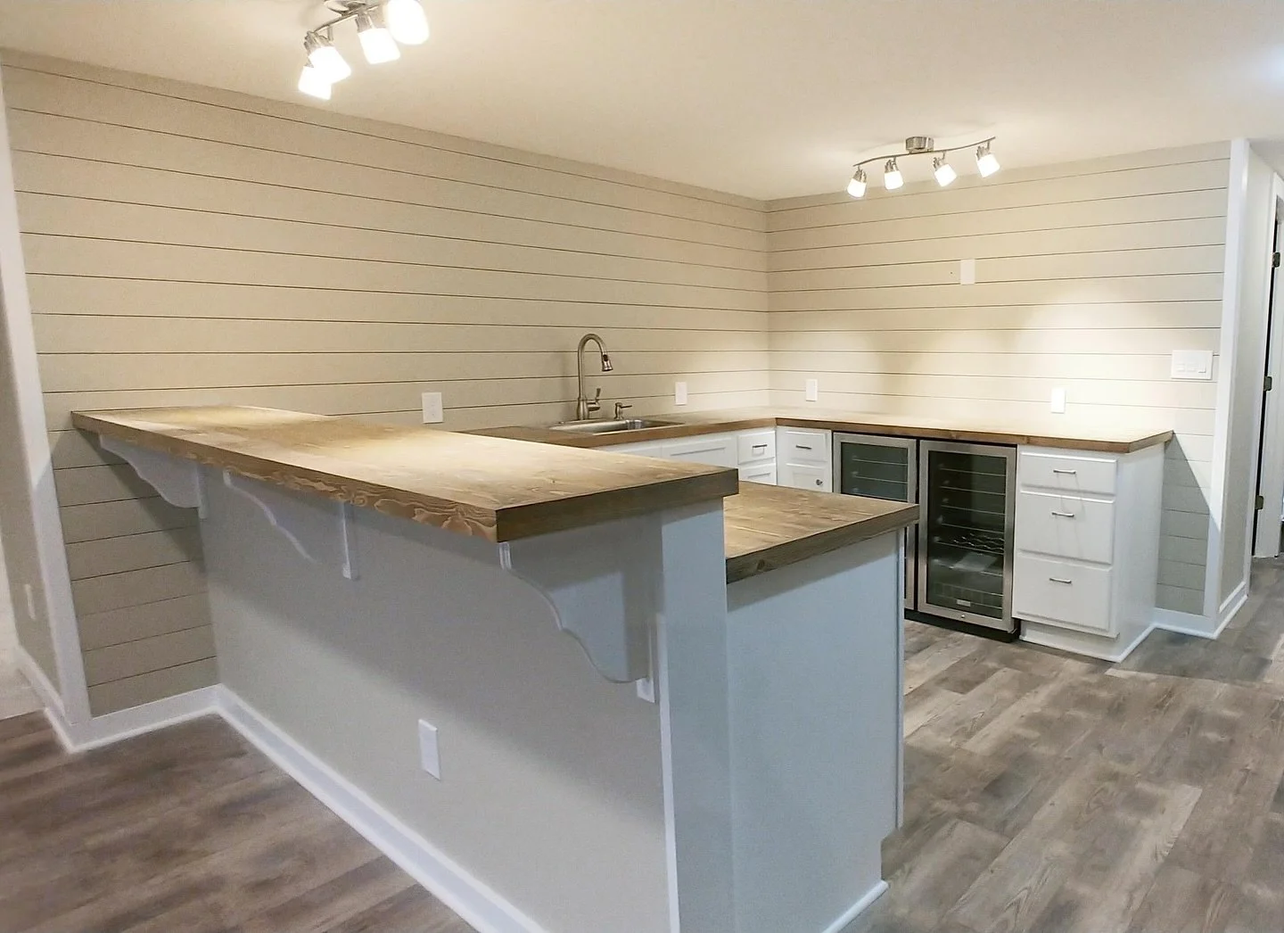 Custom projects include complete basement remodels! New bar and kitchen. Flooring, lighting, fresh paint snd shiplap walls. 

Reach out today for a free estimate if you&rsquo;re looking for a transformed basement kitchen and rec space. Or any other c