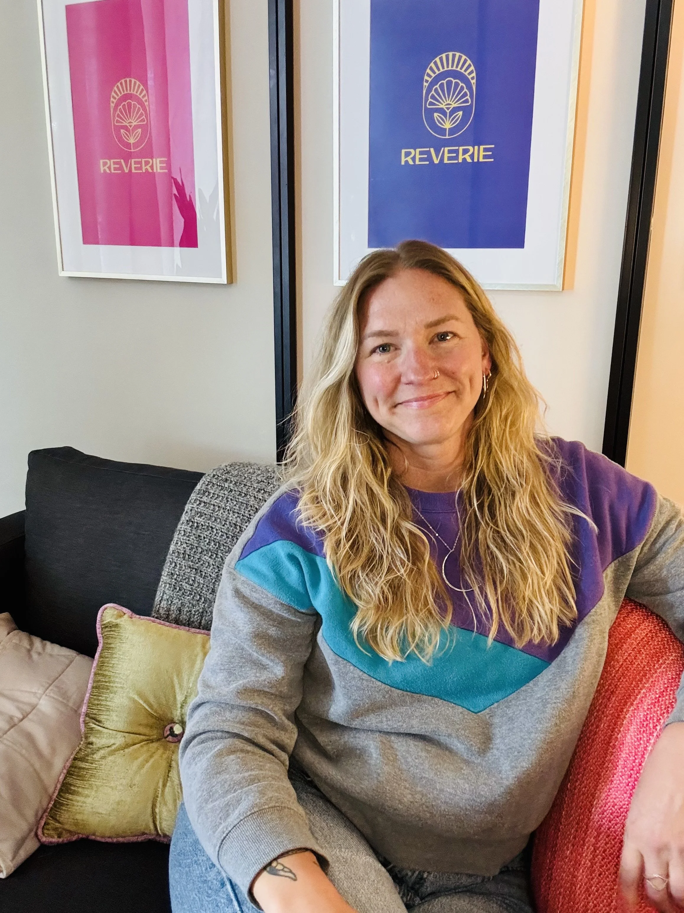 therapist smiling softly in their RiNo, Denver office
