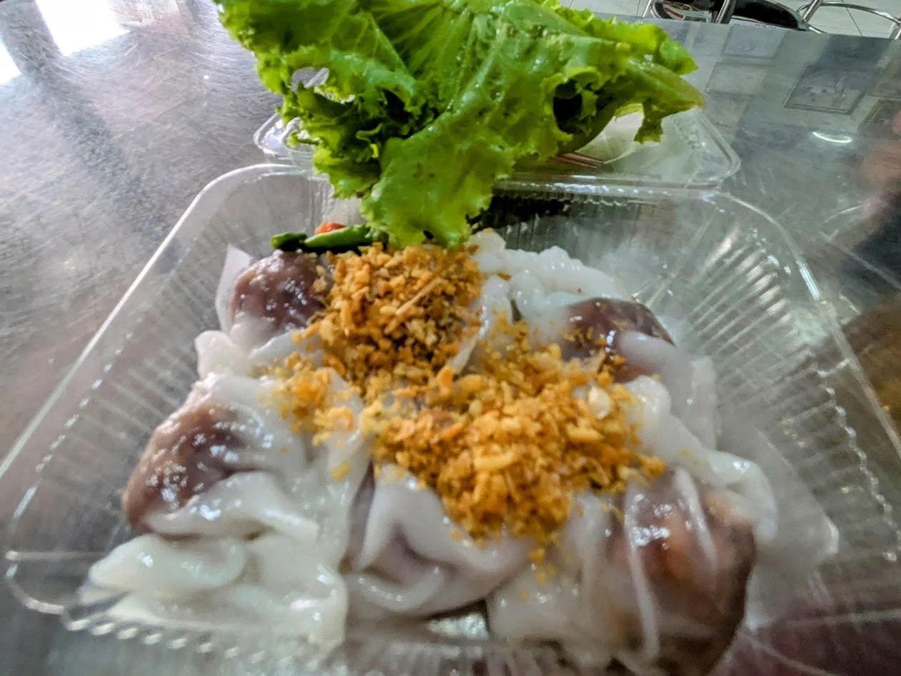 Khao Kriap Pak Mo - Steamed rice-skin dumplings that are delicate and translucent. They are typically filled with a savory mixture of minced chicken, shrimp, peanuts, and turnip. Ours were vegetarian. They were delicious! You wrap them in a lettuce l