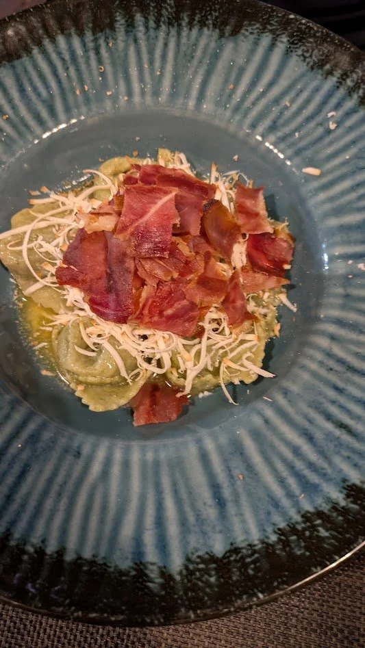 Pasta topped with Prosciutto -  the tradition of dry-curing ham dates back thousands of years to the Roman Empire.  Grady's was served over pasta with cheese. He definitely enjoyed it!