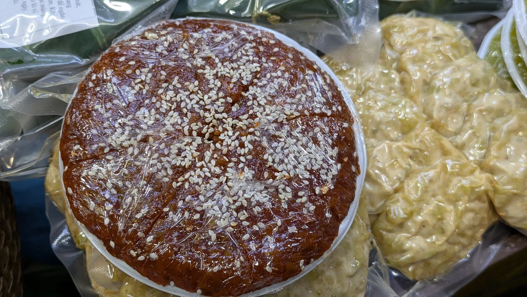 Chè kho - a traditional Vietnamese dessert popular in Northern Vietnam, particularly during the Lunar New Year (Tết). It is made from finely ground, steamed mung beans, sugar, and sometimes coconut milk, then pressed into molds and topped with sesame