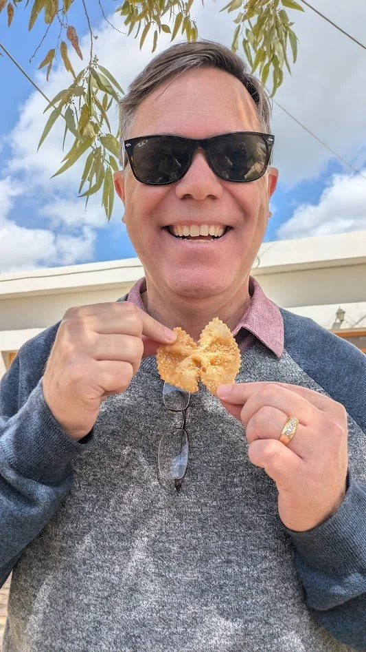 Xerotigana - a traditional, deep-fried pastry ribbon folded into the shape of a bow ties then fried in olive oil until crisp. Once fried, they are drenched in warm honey and sesame seeds. They were really good.