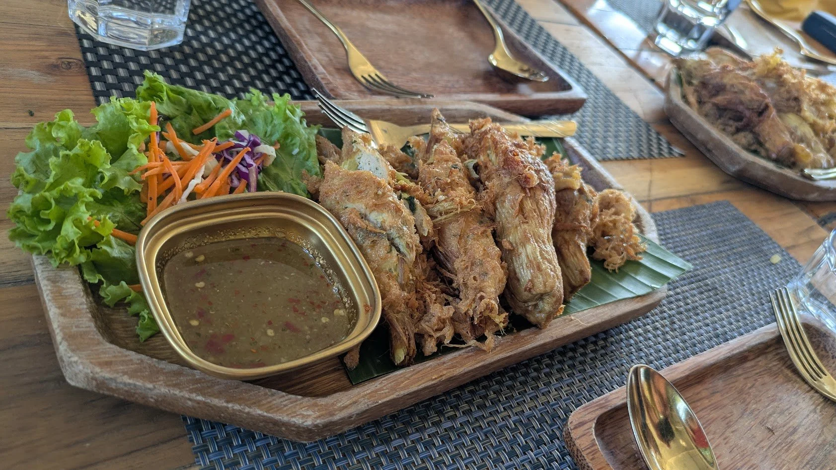 Mok Nor Mai - Bamboo Shoots stuffed with chicken, pork, and lemongrass. Grady thinks they were good, but he isn't sure he actually remembers!