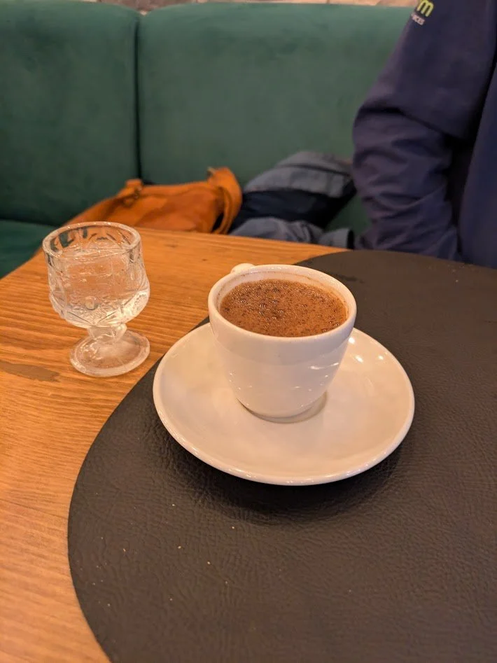 Turkish coffee - apparently a big deal here. It is supposedly stronger and a bit sweeter than regular coffee, but the big difference is that the grounds are left in it. They are like a fine sludge at the bottom of the cup. You only drink it half way 