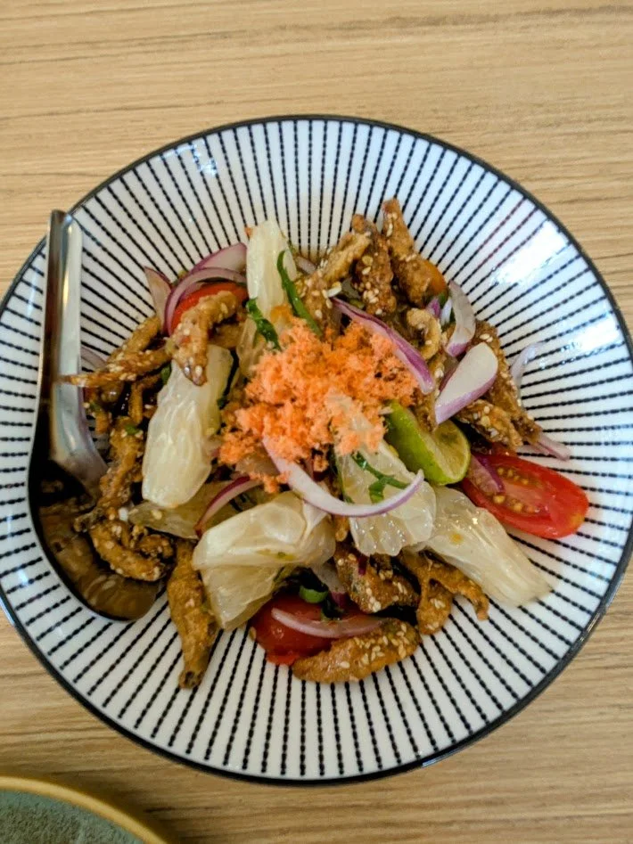 Pomelo spicy salad with crispy fish - This was an interesting (and really good) dish. Pomelo is the largest citrus fruit, native to Southeast Asia. It is larger and sweeter than grapefruit, with a mild, sweet-tart flavor. This salad had chunks of pom