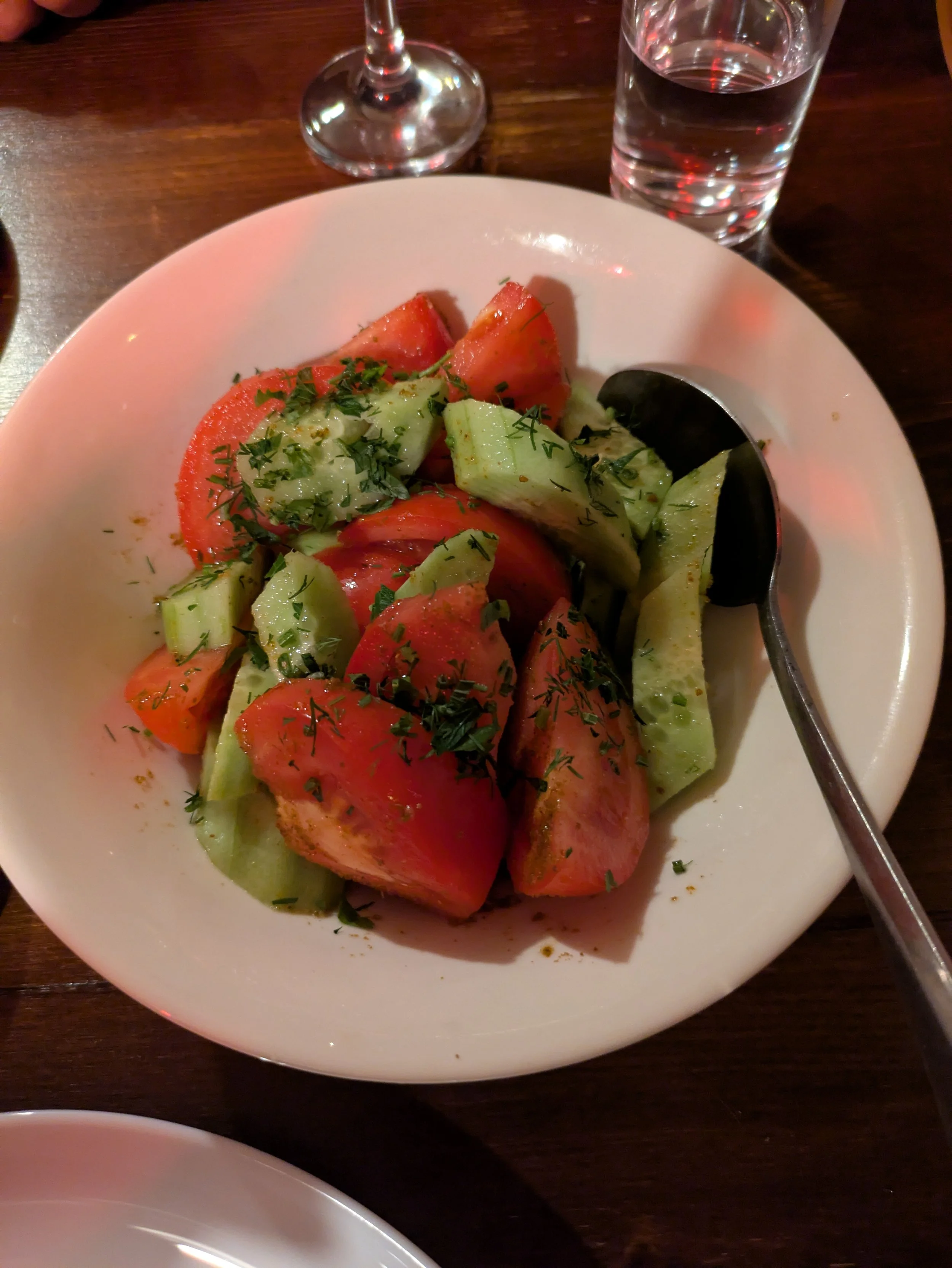 Kitri Pomidvris Salati - Georgian cucumber and tomato salad made with red onion, sunflower oil, and a lot of fresh herbs like cilantro and parsley. Often they also add walnuts (because they like to put walnuts in EVERYTHING)