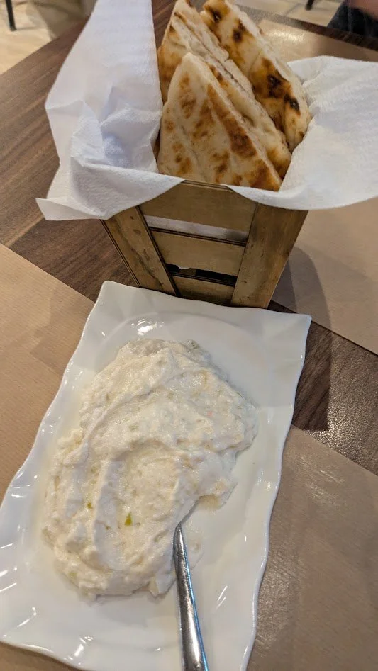 Tyrokafteri - spicy cheese dip in Corfu and Greece. It is a mezze dish made from whipped feta cheese, hot peppers, olive oil, and Greek yogurt. Also known as "cheese-burning". It was pretty good. 