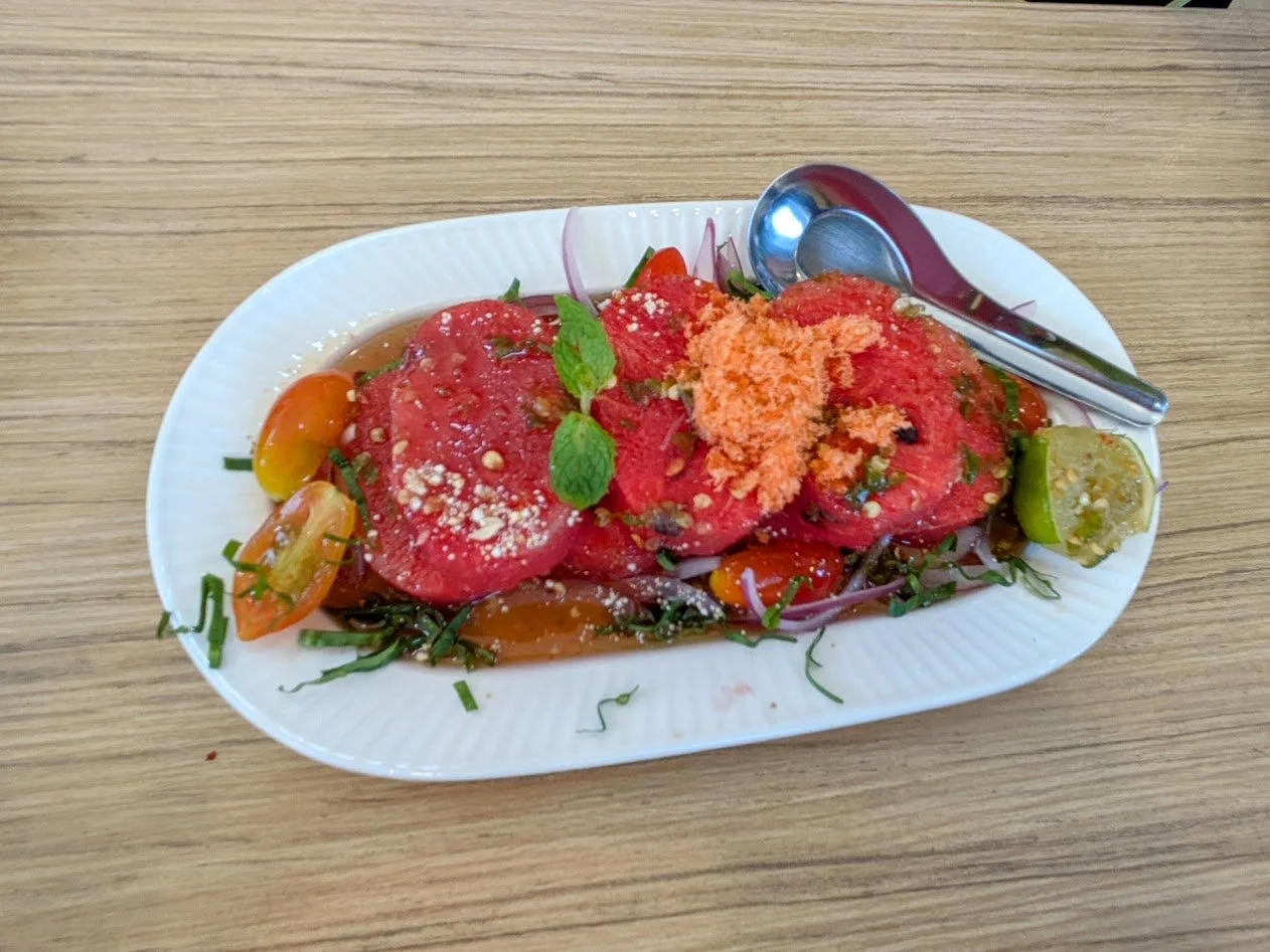 Spicy watermelon salad - Along with the watermelon, they add fish sauce, lime juice and fresh chilies to get the Thai elements (salty, sour, and spicy). I think they add chilies to pretty much everything! You have to be careful! It also had mint and 