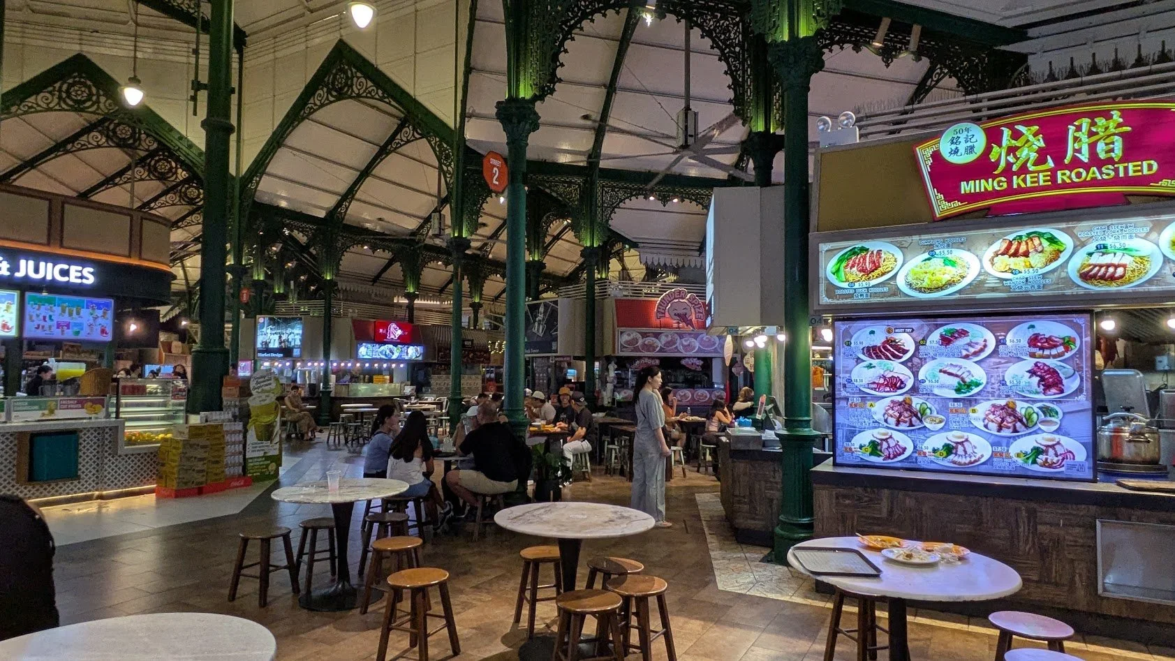 Hawker Centers - an open-air or semi-covered, food complex containing numerous independent stalls that sell affordable local dishes and drinks. At some point, Singapore stopped allowing street vendors and created these Hawker Centers which are regula