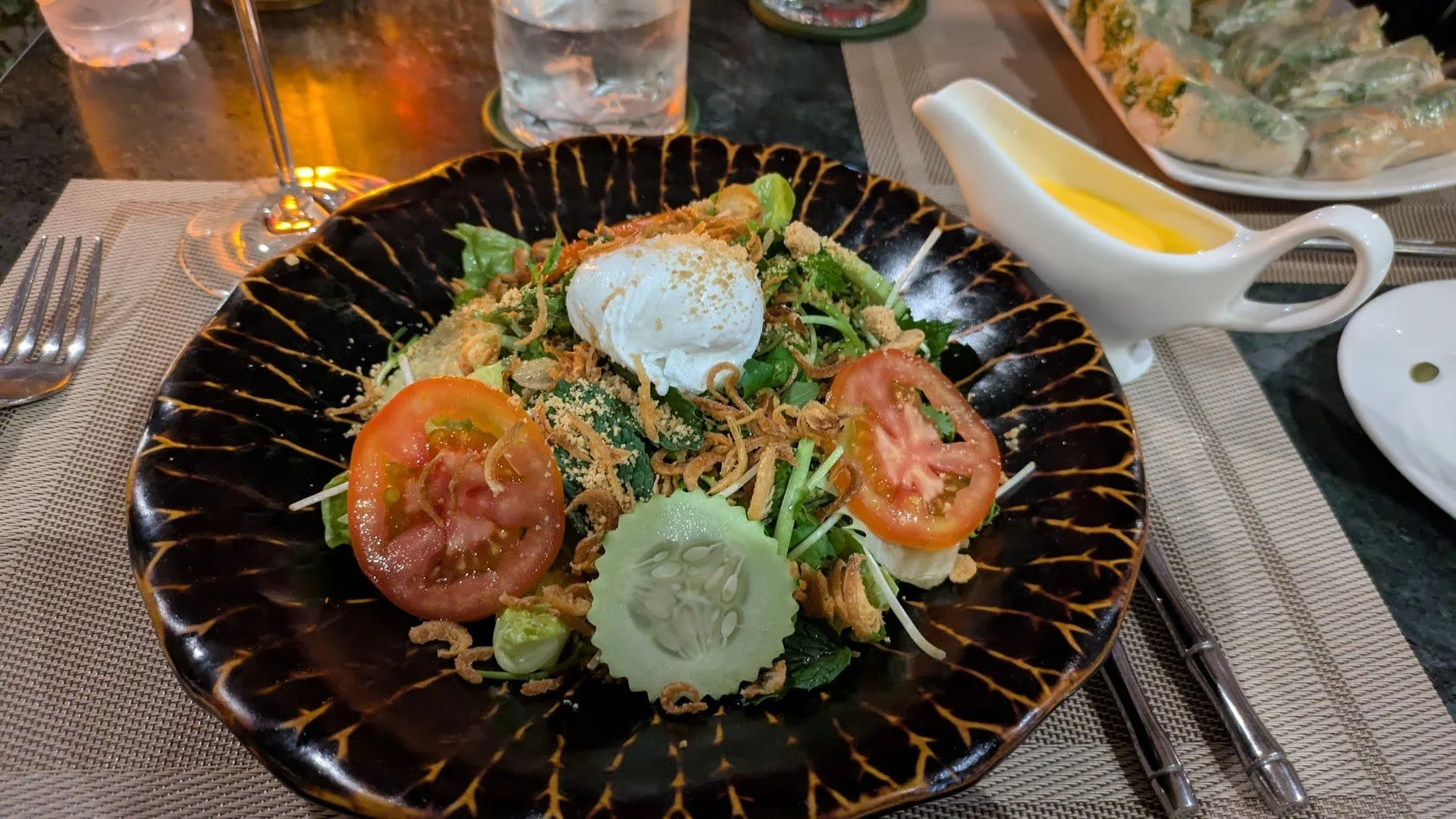 Luang Prabang Salad - A salad of watercress, lettuce, cilantro, mint, dill, tomatoes, and hard-boiled eggs, topped with roasted peanuts. Topped with a dressing often made from mashed hard-boiled egg yolks, lime juice, garlic oil, and fish sauce. I am
