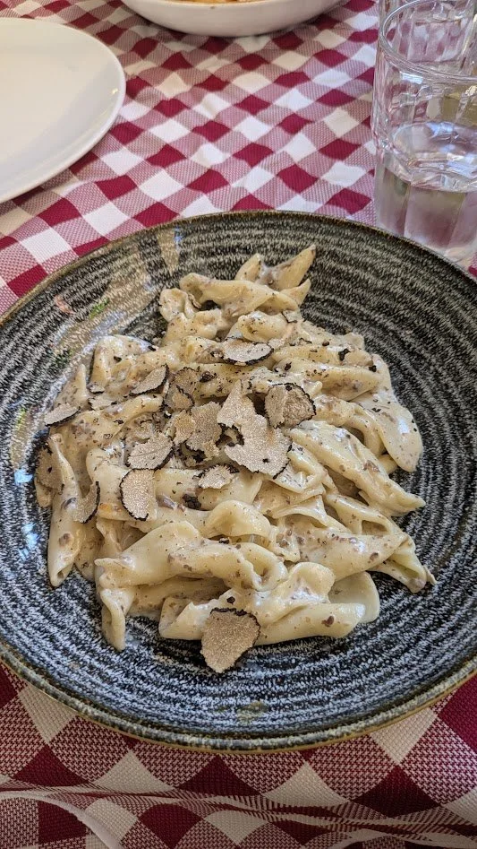 Fuži - signature hand-rolled pasta of the Istrian peninsula. It's made by pinching the opposite corners of diamond-shaped dough together to resemble a bow tie. It's typically topped with rich local sauces. Mine was topped with some kind of white sauc