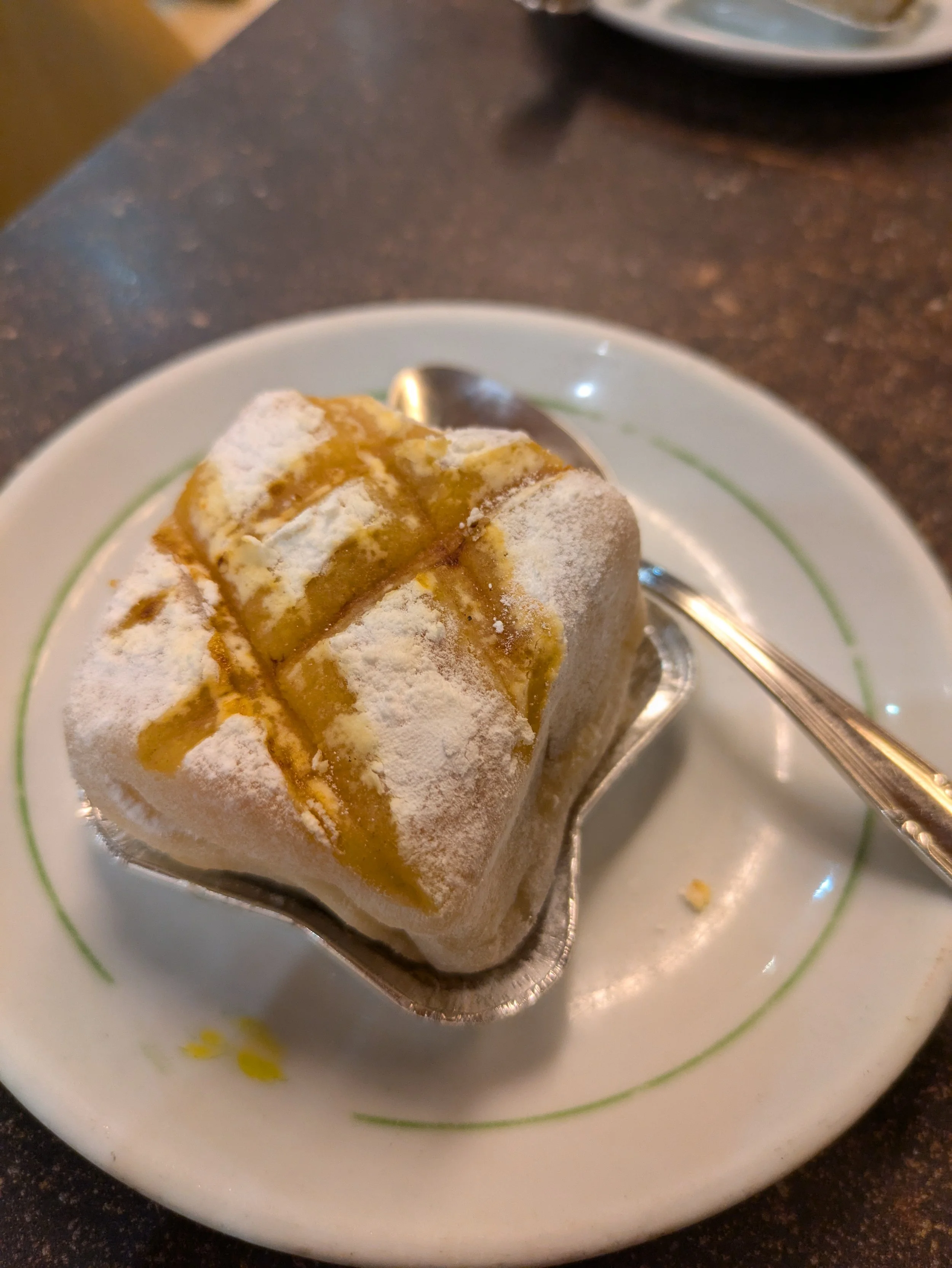 Ponche Segoviano - a traditional cake from Segovia, consisting of layers of sponge cake soaked in syrup, filled with custard, and covered in marzipan. Ours was lemon flavored - Yum!
