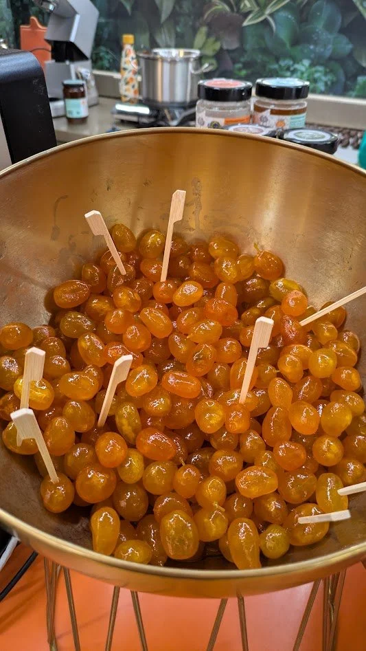 Candied kumquats - a popular delicacy from Corfu. Small, whole bitter-sweet citrus fruits simmered in a sugar syrup until translucent and tender. They are a popular way to preserve the fruit for months. They were actually pretty good. Now I want a Ku