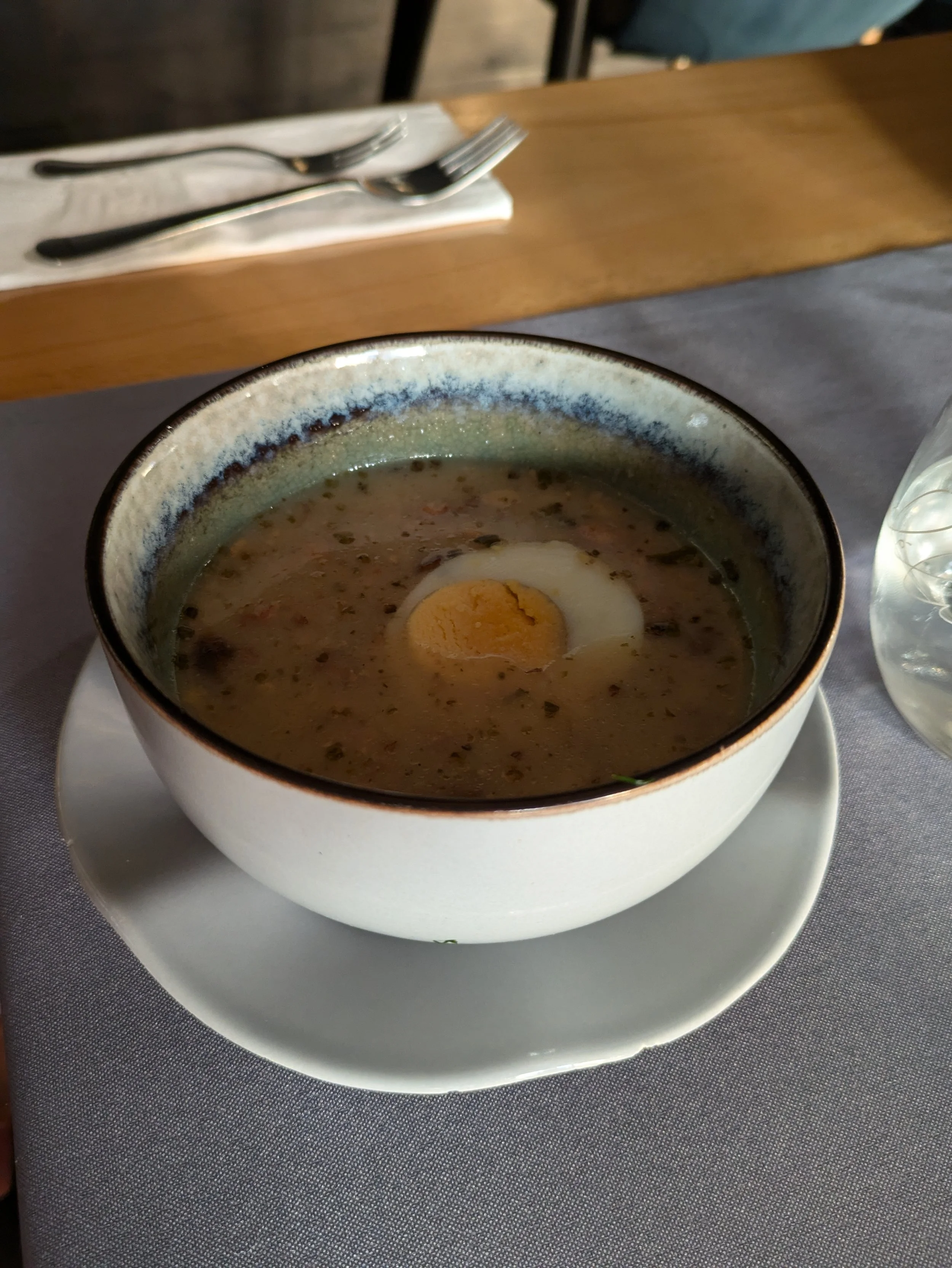 Food tour stop #4 - Zurek soup (for Grady) made with pork, seasonings, potatoes, and a bunch of other things that we can’t remember. Plus a hard boiled egg floating on top.