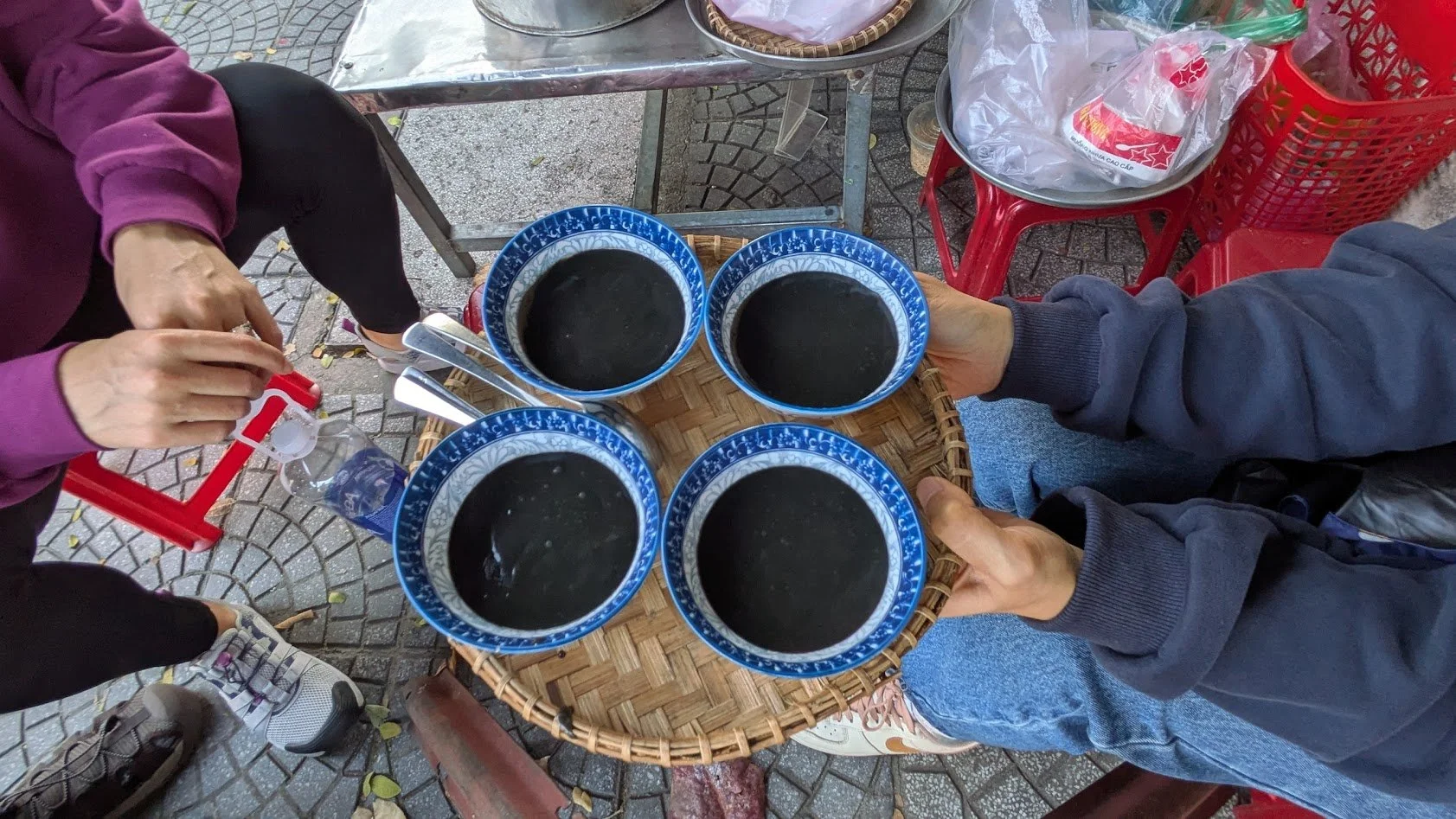 Xi ma is a black sesame pudding found in Hoi An that is served warm and is slightly sweet. It is a thick, black pudding made from ground black sesame seeds, coconut, rice flour, and traditional Chinese medicinal herbs. We got it during our food tour 