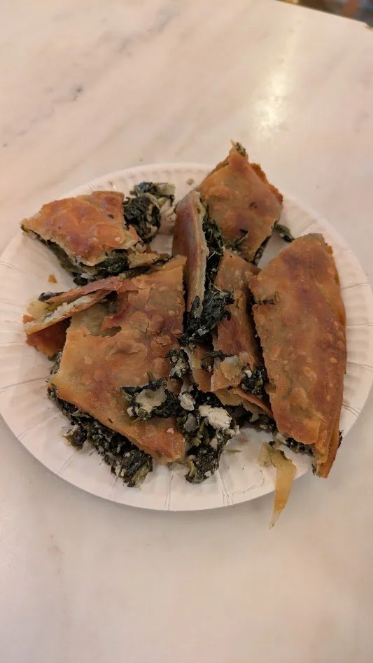 Spanakopita - a traditional Greek savory pastry consisting of flaky phyllo dough filled with a mixture of spinach, feta cheese, onions, herbs, and eggs then brushed with olive oil, baked until golden brown. This stuff was so freaking good!