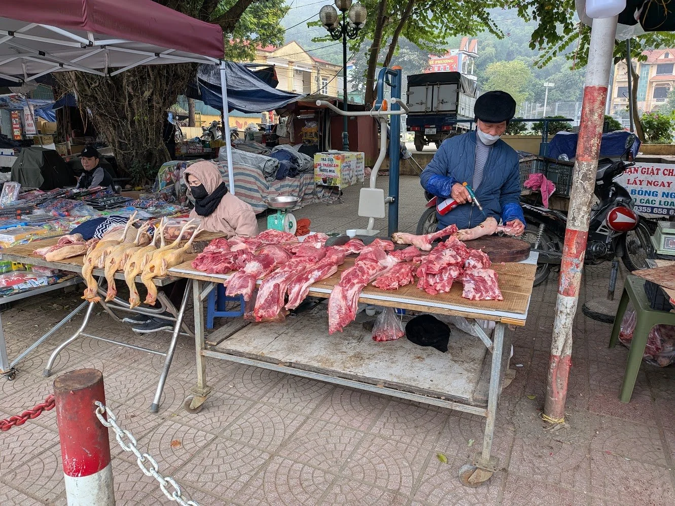 Food at the market - chicken and other gross stuff are featured in this photo. They literally just had dead animals and hunks of meat laying out uncovered and with no temperature control. It was so disgusting!