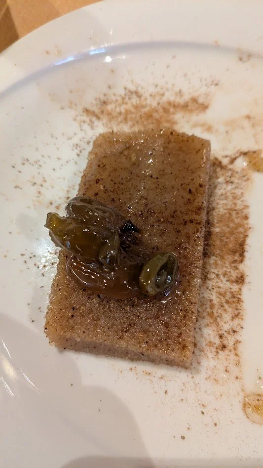Greek semolina halva -  a traditional, vegan Greek dessert pudding made by toasting semolina in oil, then boiling it with syrup, nuts, and spices. It was pretty good (different). We were given it for free when we were finished eating. They like to th