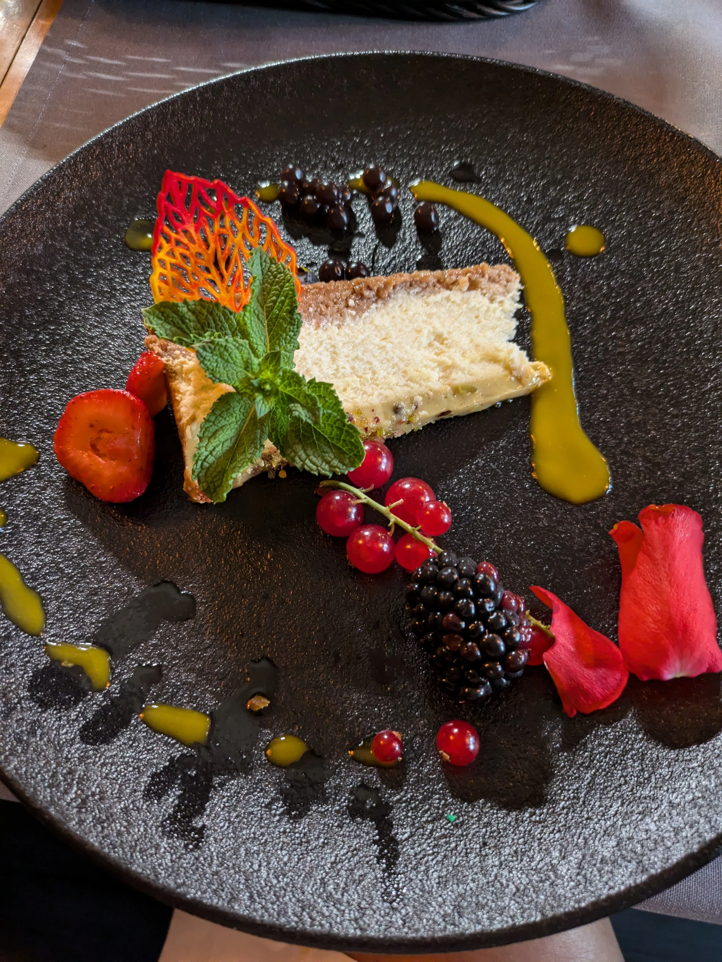 Food tour stop #4 - Dessert of a delicious cheese cake with a pistachio topping and some local fruits I had never seen before. Delicious