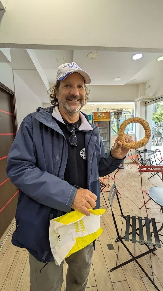 Koulouri Thessalonikis - a traditional, iconic Greek street food consisting of a crunchy, sesame-seeded bread ring. Originating from Thessaloniki during the Byzantine era, it is a staple breakfast or snack throughout Greece, often sold by street vend