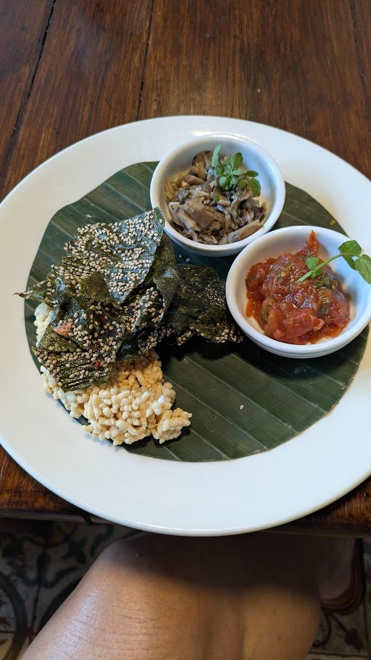 Kaipen - a traditional Laotian snack made from freshwater green algae (called kai), primarily harvested from the Mekong River. The algae is washed, pounded into a paste, pressed into paper-thin sheets, and sun-dried on bamboo mats. It is served with 