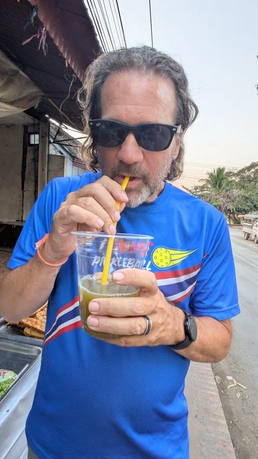 Palm Sugar Juice - Palm juice (known as Mak Tao) is derived from the sap of various palm trees, offering a, sweet nutrient-rich drink. Personally, I thought it was kind of gross. We got it from a street vendor that was pressing the palm branches righ