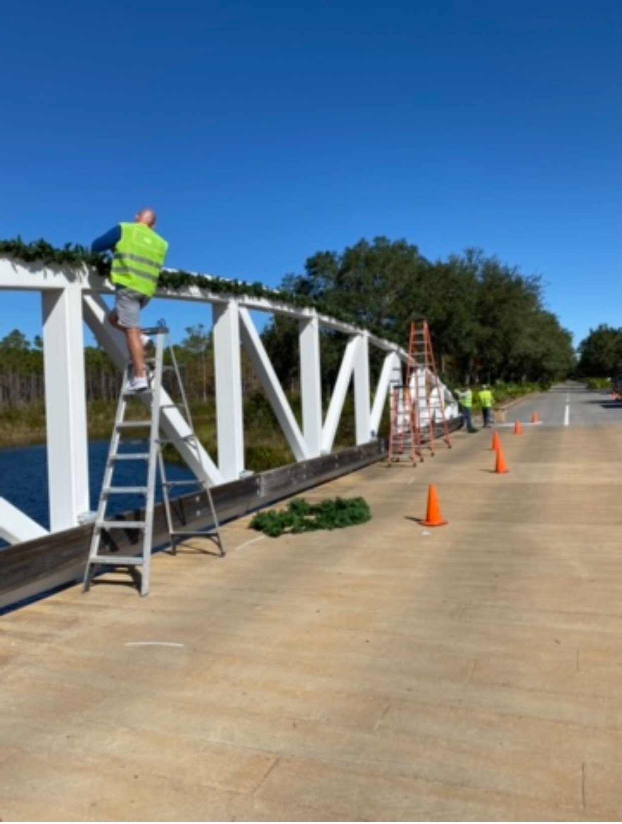 Adding garland to bridge rail.jpeg