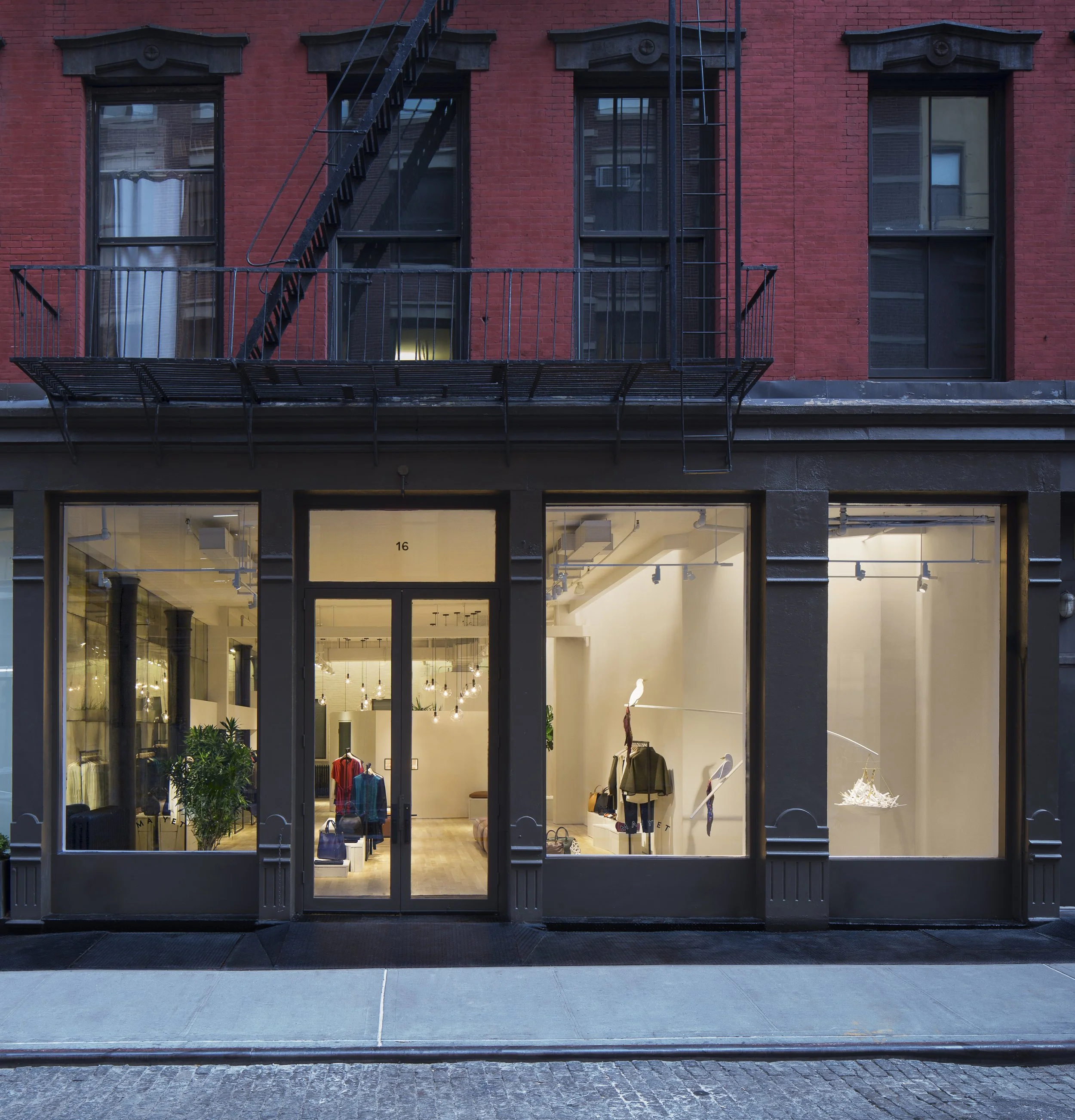 Maiyet's black cast-iron storefront on a historic SoHo street in New York City