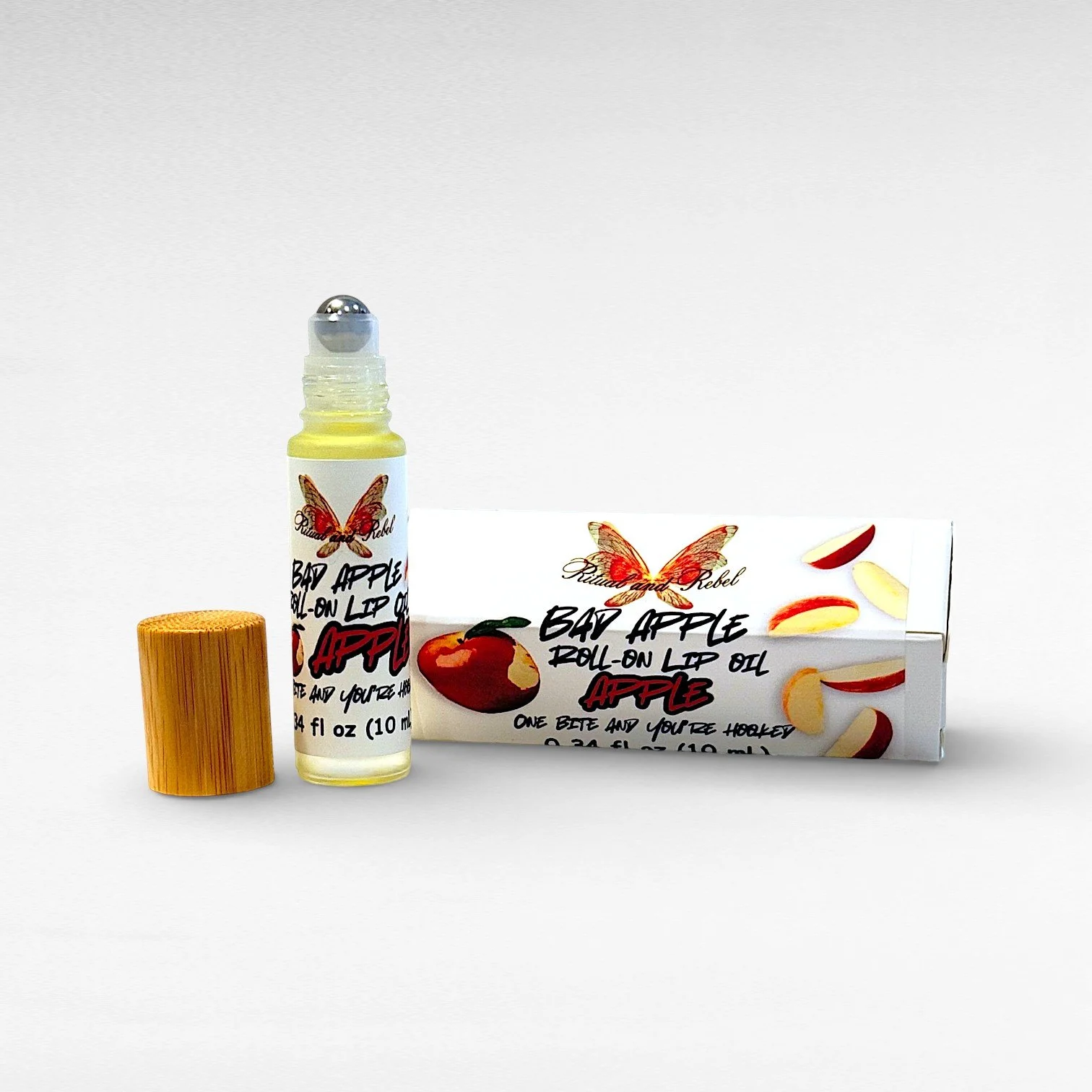 Bed Apple red apple lip oil roll on with box ritual and rebel.jpg