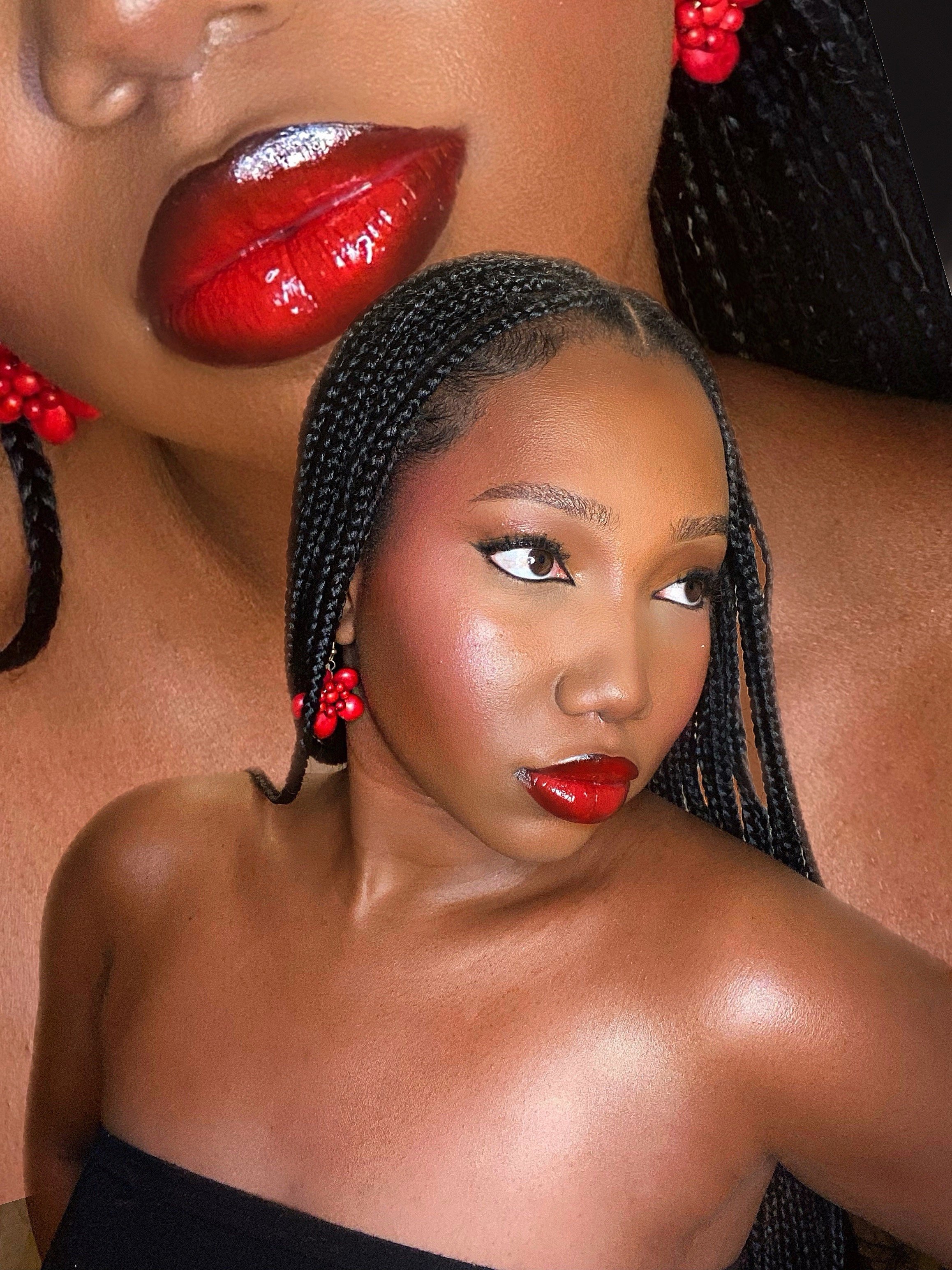 A woman with braided hair, red berry earrings, and dark red lipstick, with a large, close-up photo of her lips in the background.