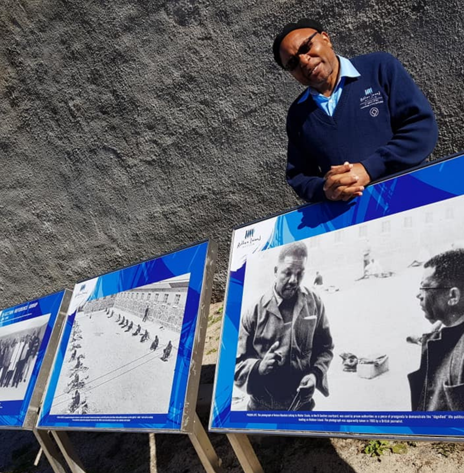 Local South African guide sharing historical insights at an outdoor heritage site