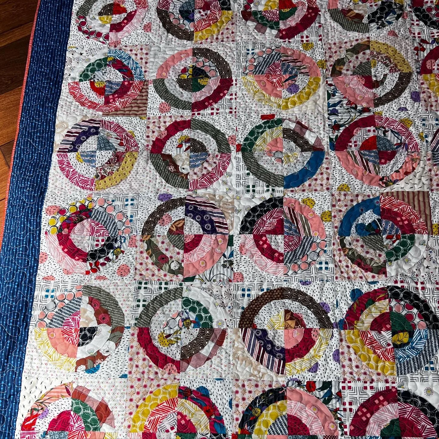 This one done with raw edges on the circles. A simple stipple on the longarm makes for a classic look #longarmquiltingservices #quiltingservices #simplestipple