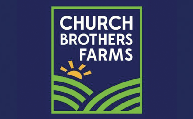 Logo for Church Brothers Farms featuring a stylized sun rising over green fields outlined in green on a dark blue background.