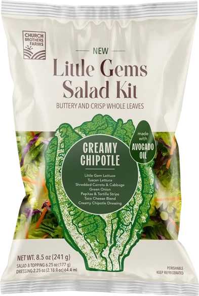 Packaging of Little Gems Salad Kit with creamy chipotle dressing, including lettuce, shredded carrots, green onion, and toppings made with avocado oil.