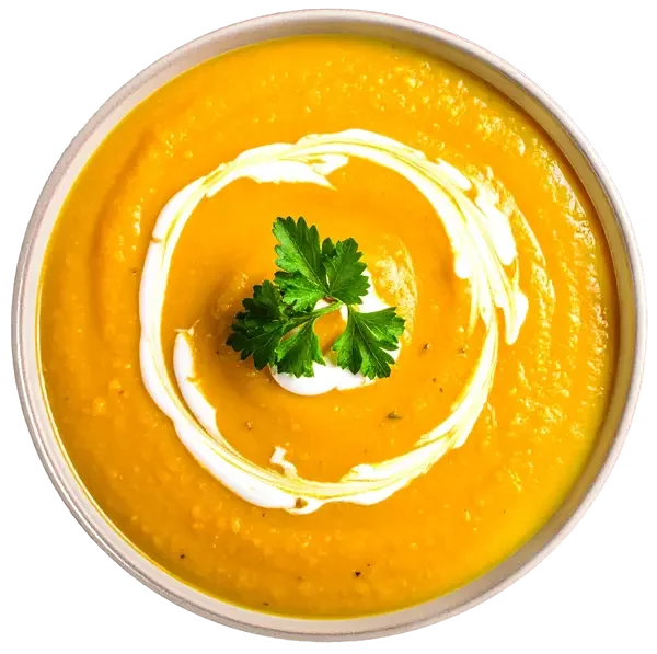 Bowl of Butternut Squash soup with sour cream and parsley on top.